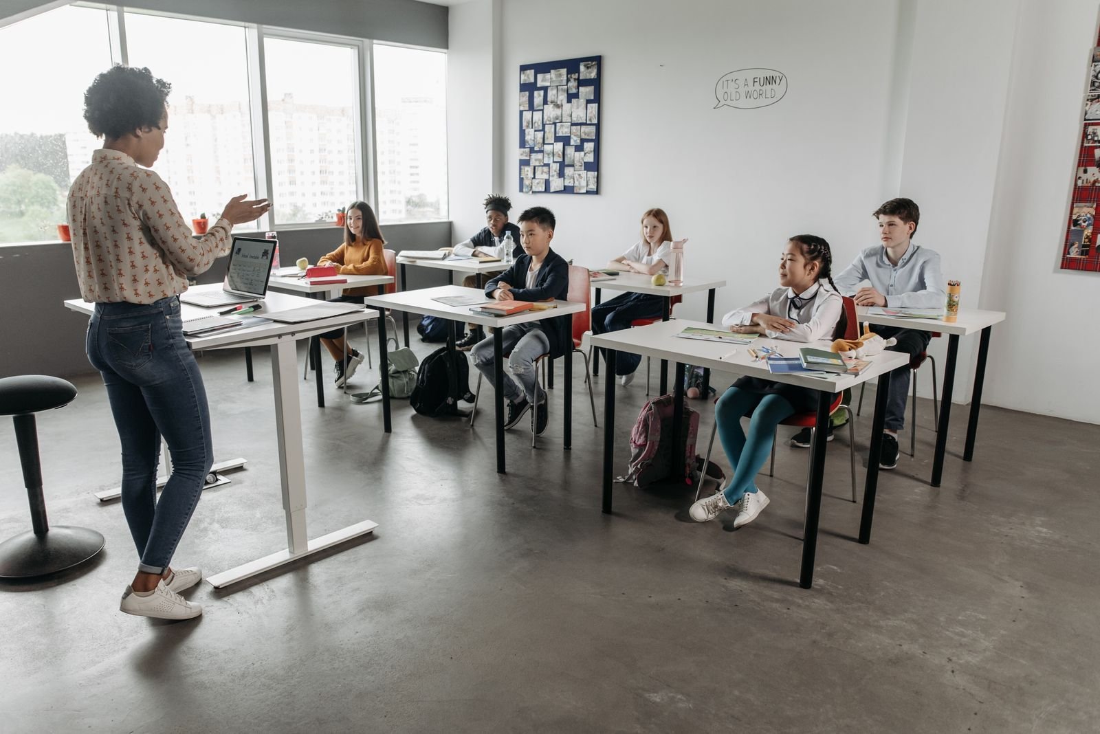 Teacher interacting with adult beginner students in classroom
