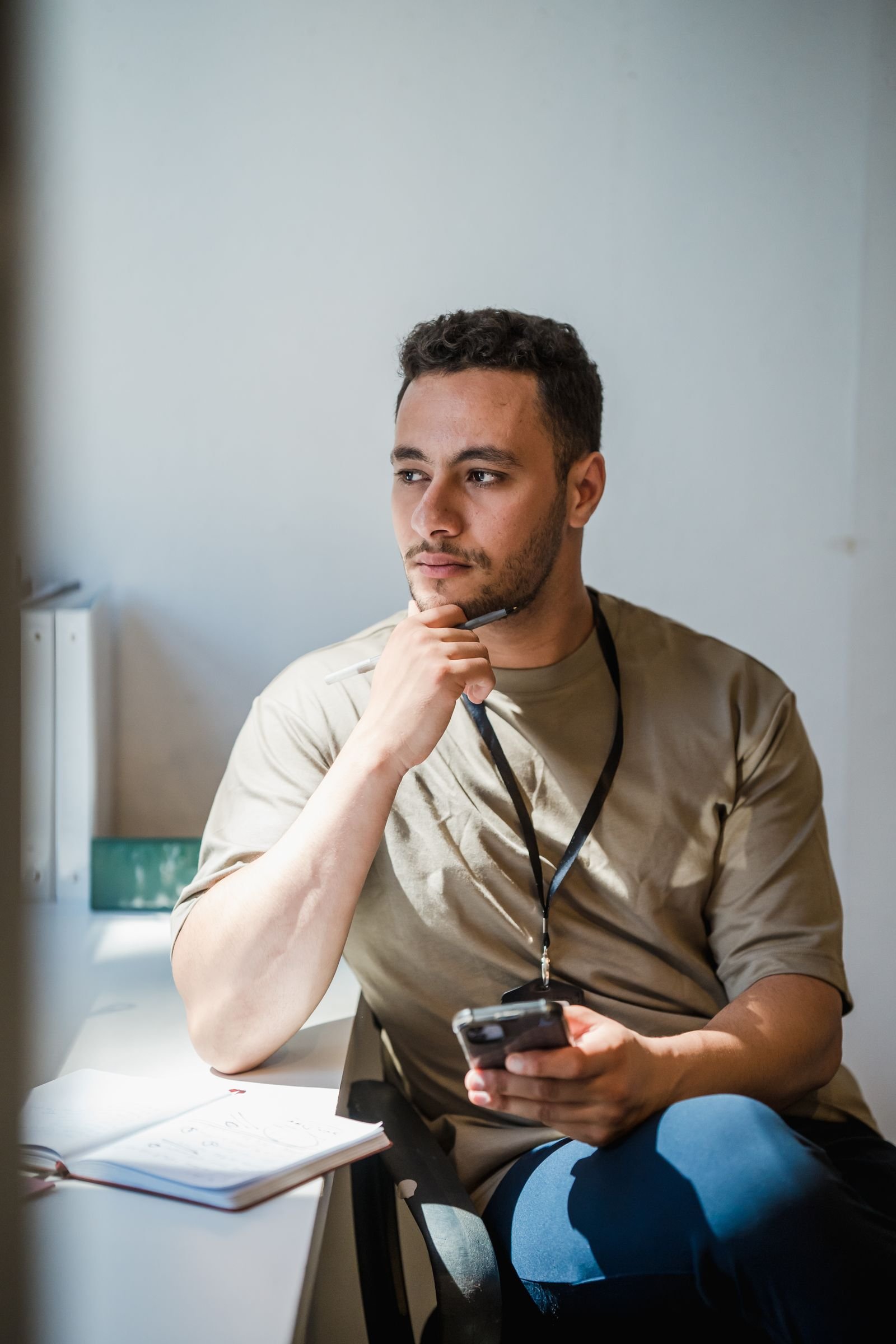 Contemplative business leader thinking by office window
