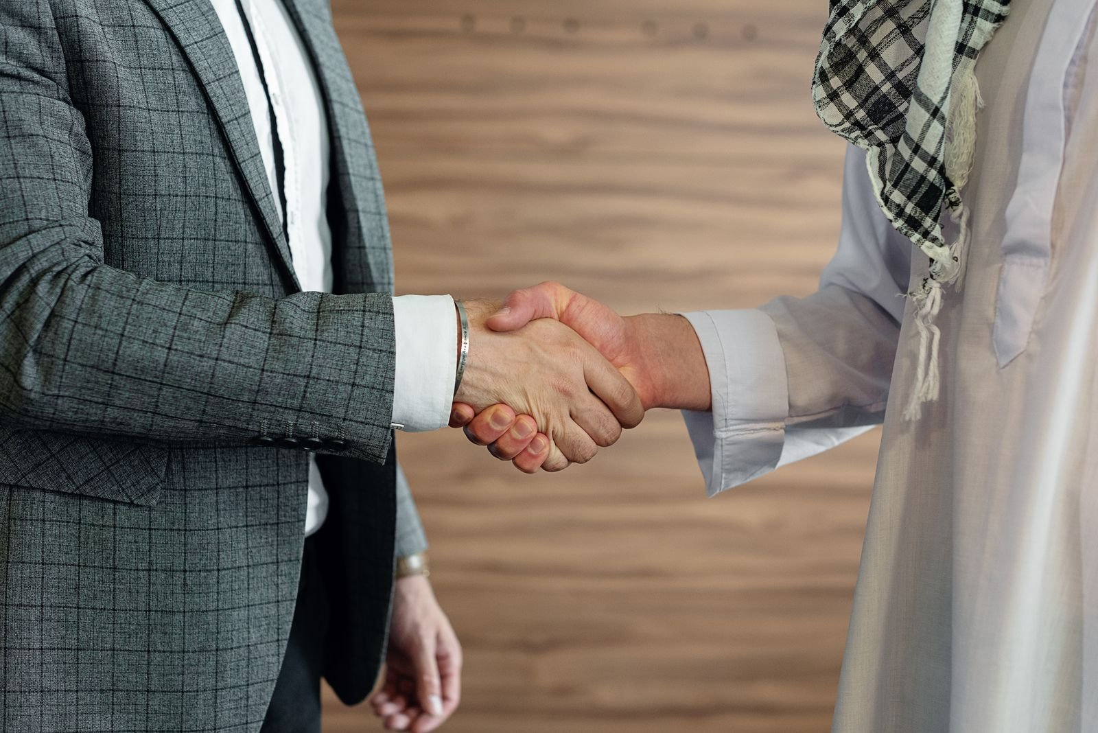 Cross-cultural business handshake symbolizing partnership
